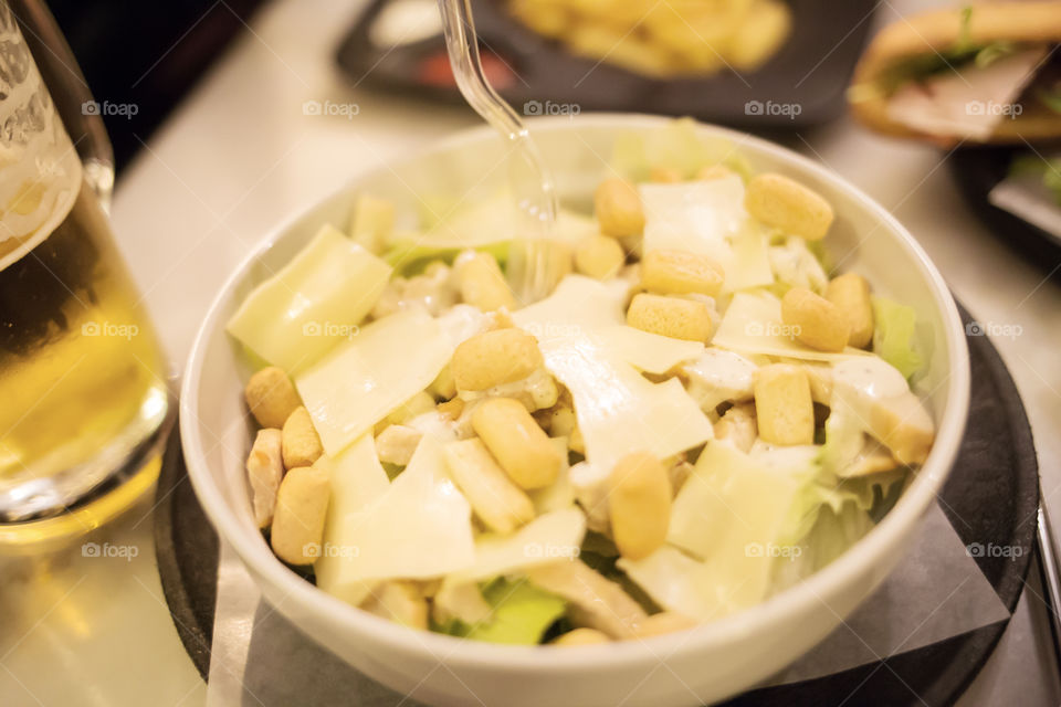 Close-up Of caesar salad in bowl on table