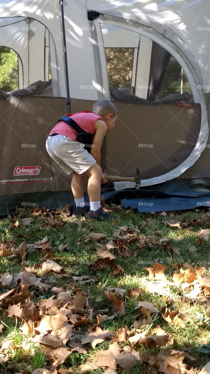Camping adventures, helping set up the tent...