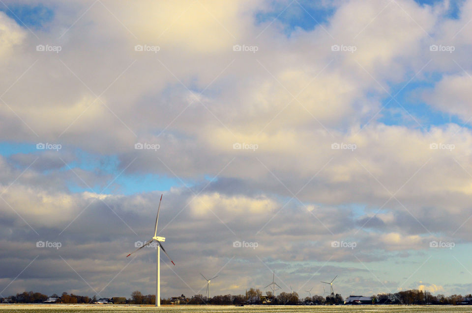 Wind mills with cloudy sky