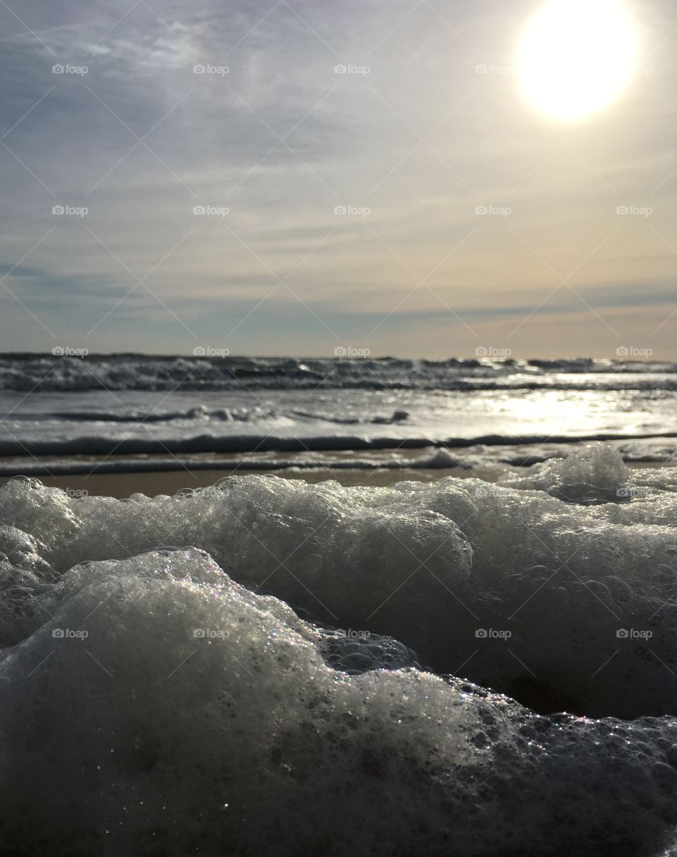 Foamy ocean at sunrise 