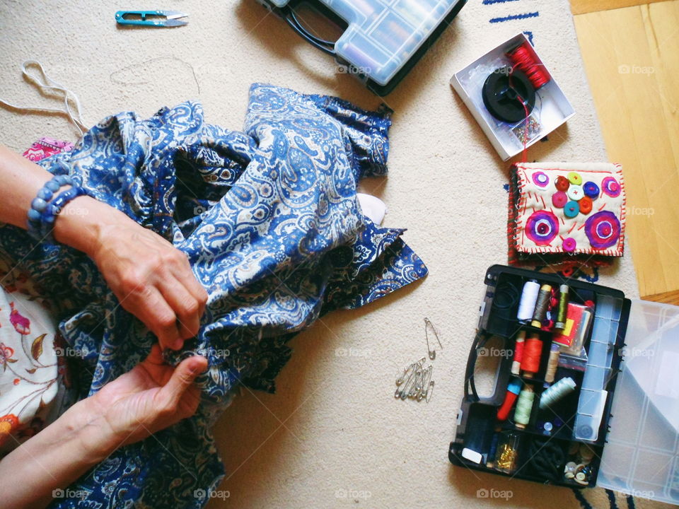 the girl sews a skirt