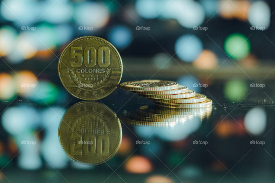 Costa Rica's macro metal coin photography, with a blur in the background