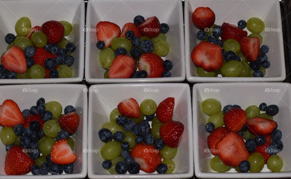 Snack time for some fresh fruits,  strawberries,  blueberries and grapes