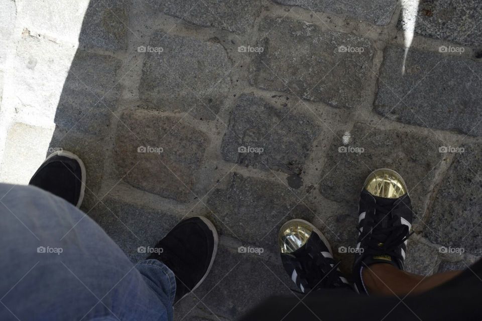 our feet on an ancient walkway near the aya sofia in Istanbul Turkey