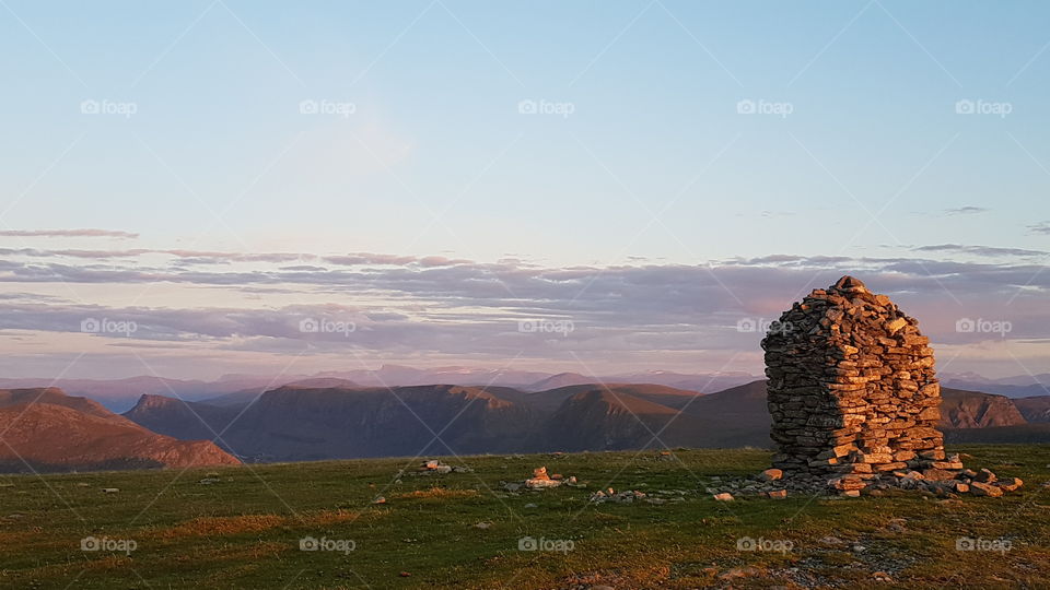 Stone shelter at the top of Vestkapp Mountain at sunset: Stadlandet, Norway.