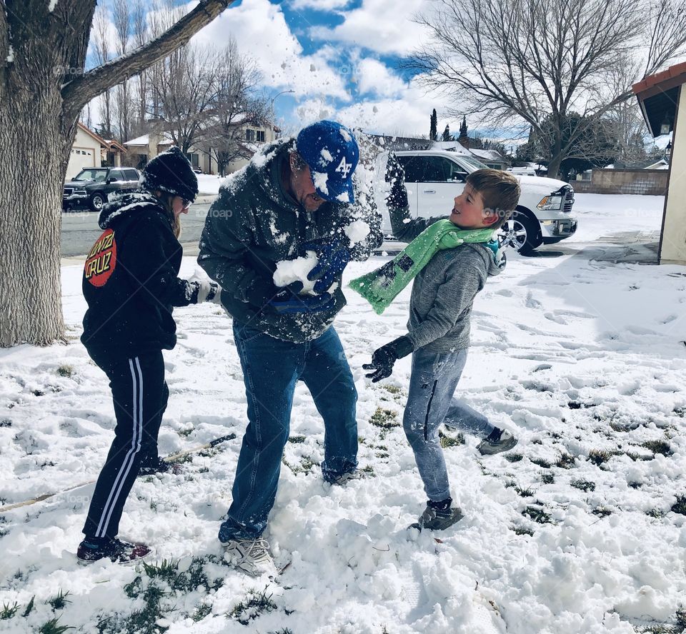 Everyone get Papa! Snow day fun! 