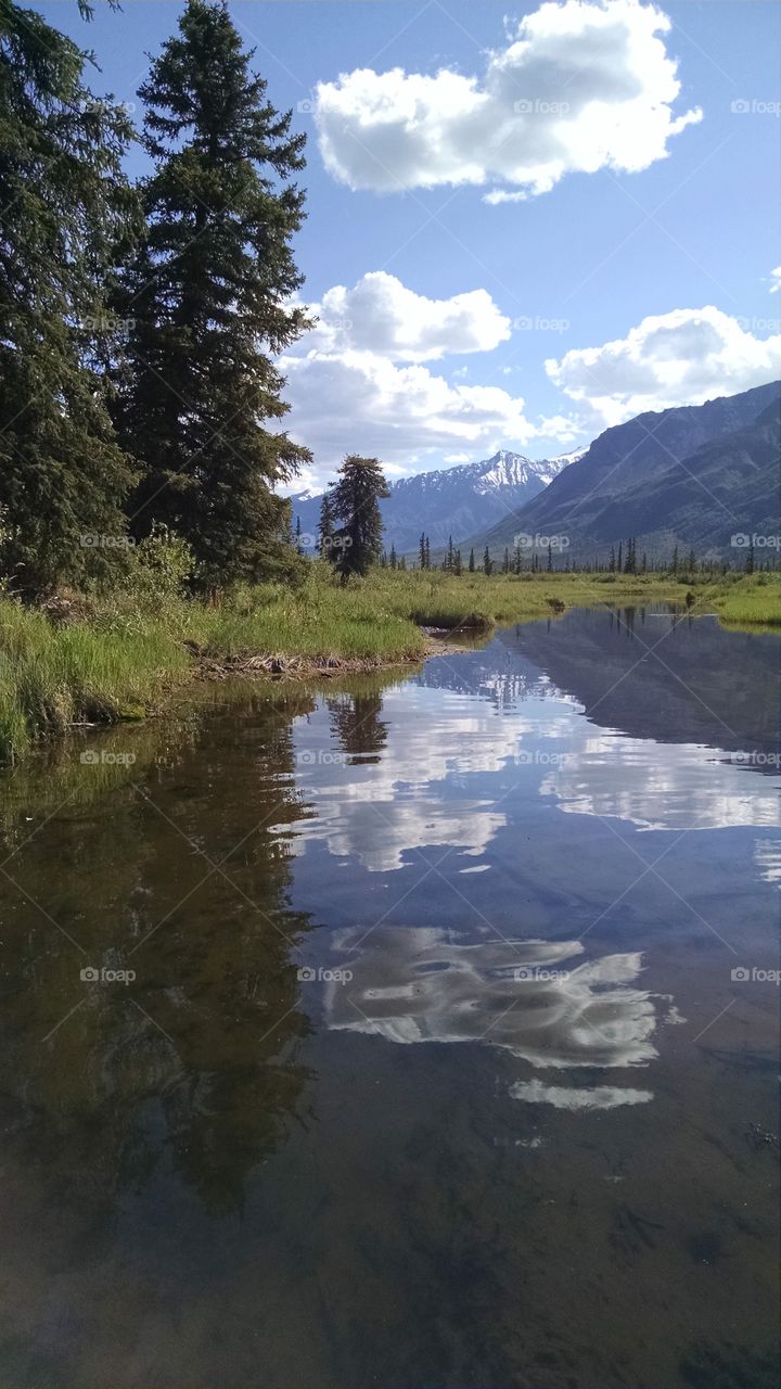 Reflection in the high mountain lake of Alaska