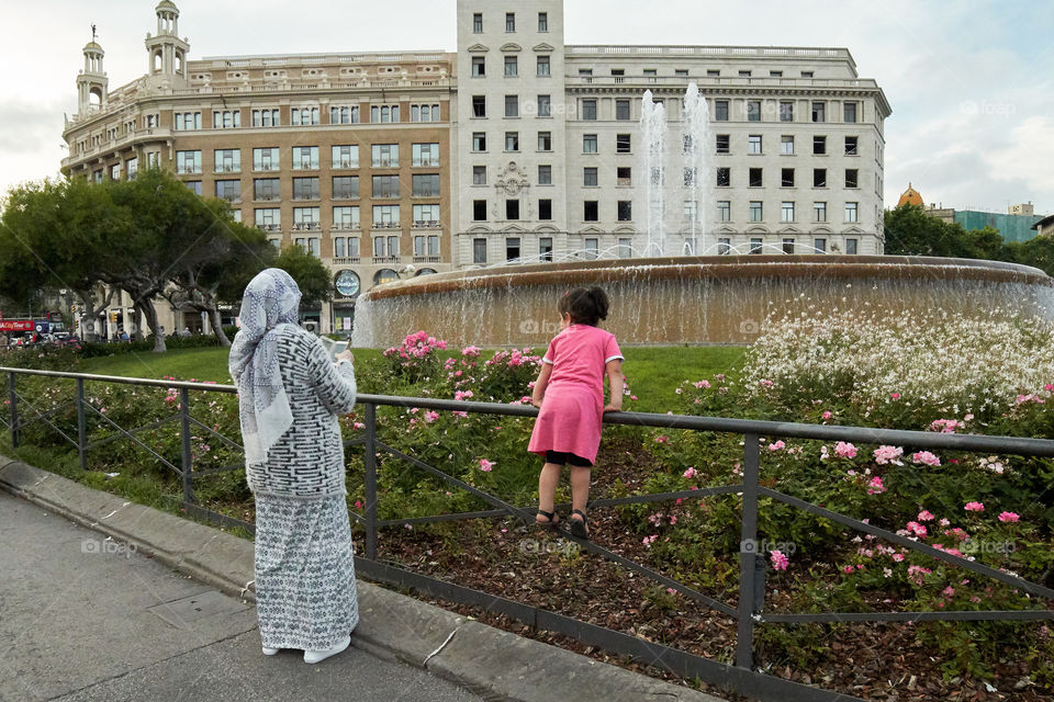 Mother taking a photo of her daughter 