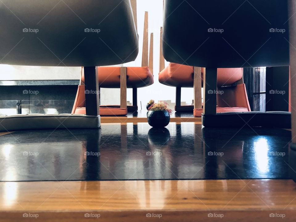 Upturned chairs waiting on empty tables