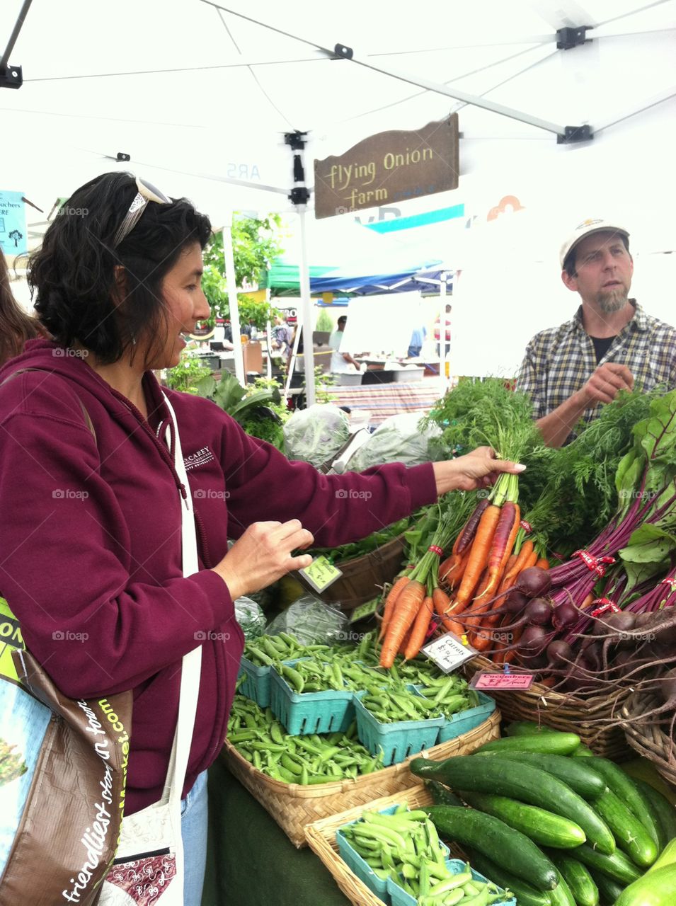 Woman buying vegetable