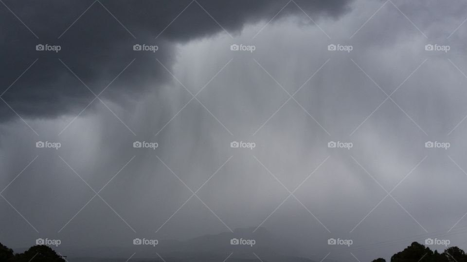 Ghost of Fisher's Peak. Heavy rain storm in Trinidad Colorado it almost looks like it's a silhouette of fishers peak