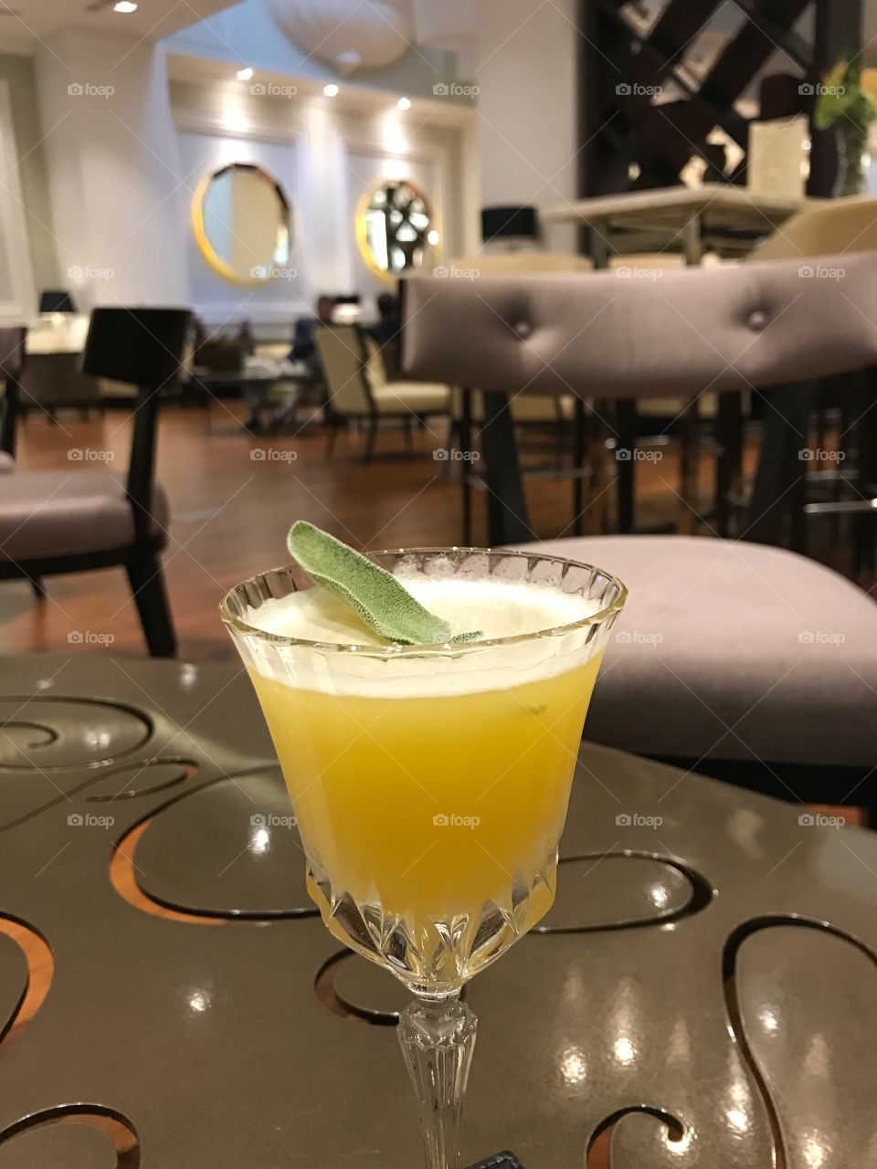 Ananas non alcholic cocktail with a leaf of sage