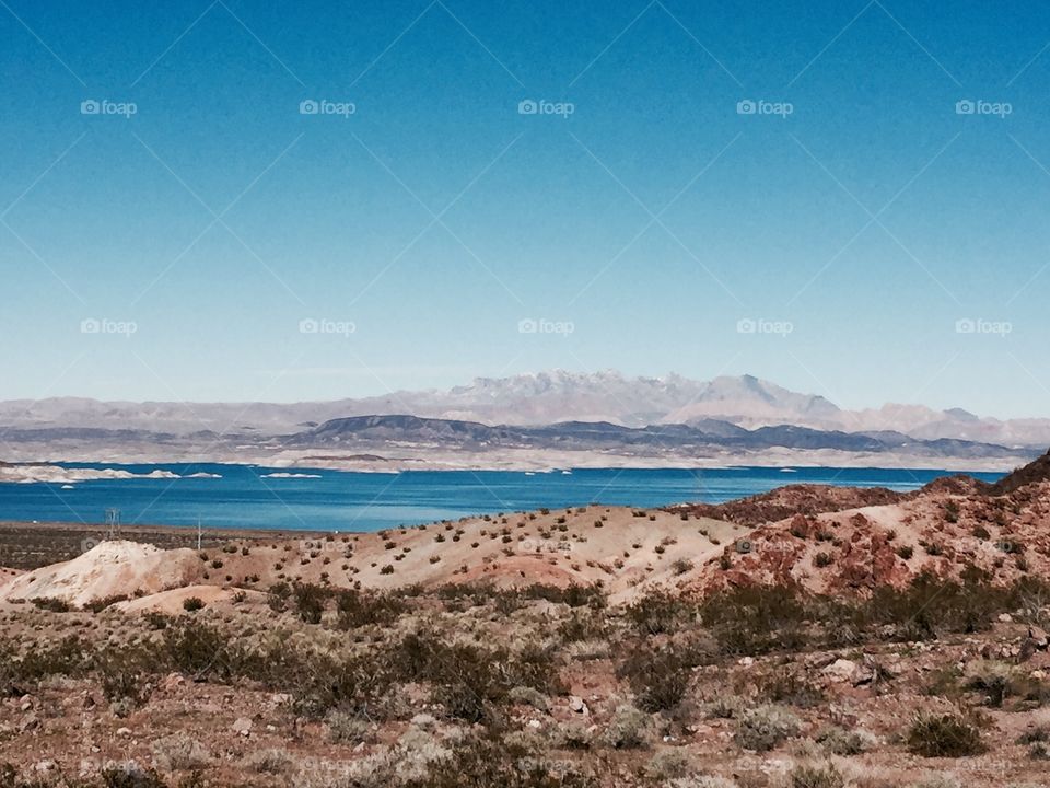 View of a blue lake against sky