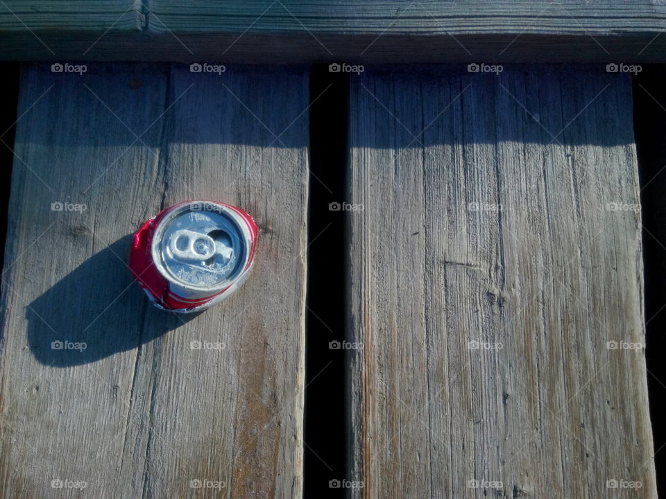 Crushed like an empty soda can. squashed can