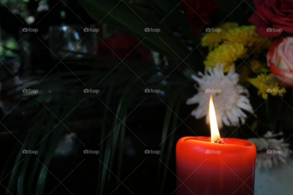 Lit candle to honour those who have passed away. Photo taken in a cemetery in Mexico 