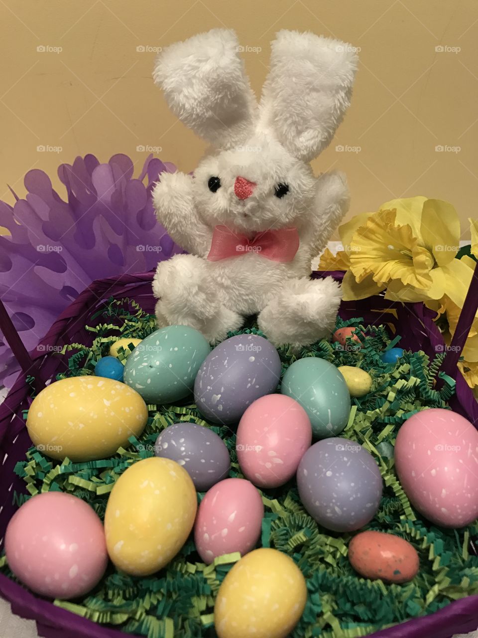 Easter bunny basket with colored eggs