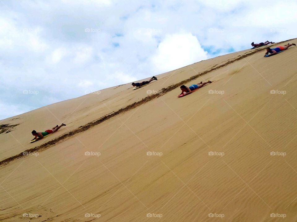 racing down sand dunes