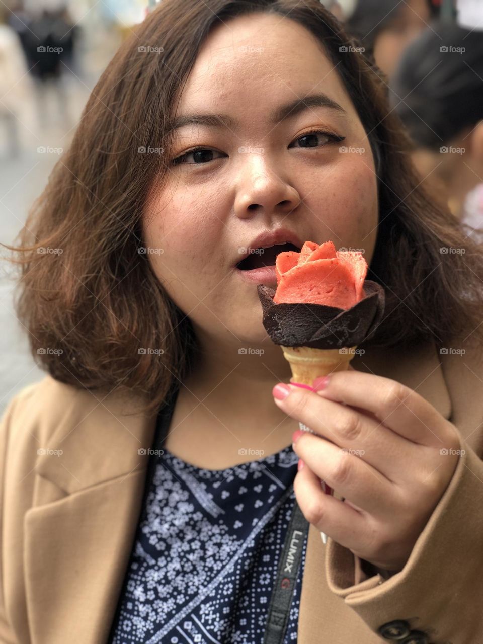 A girl happy holding an ice cream