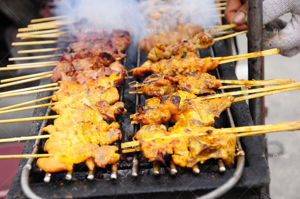 Chicken is grilled on a hot charcoal stove, Thaifood