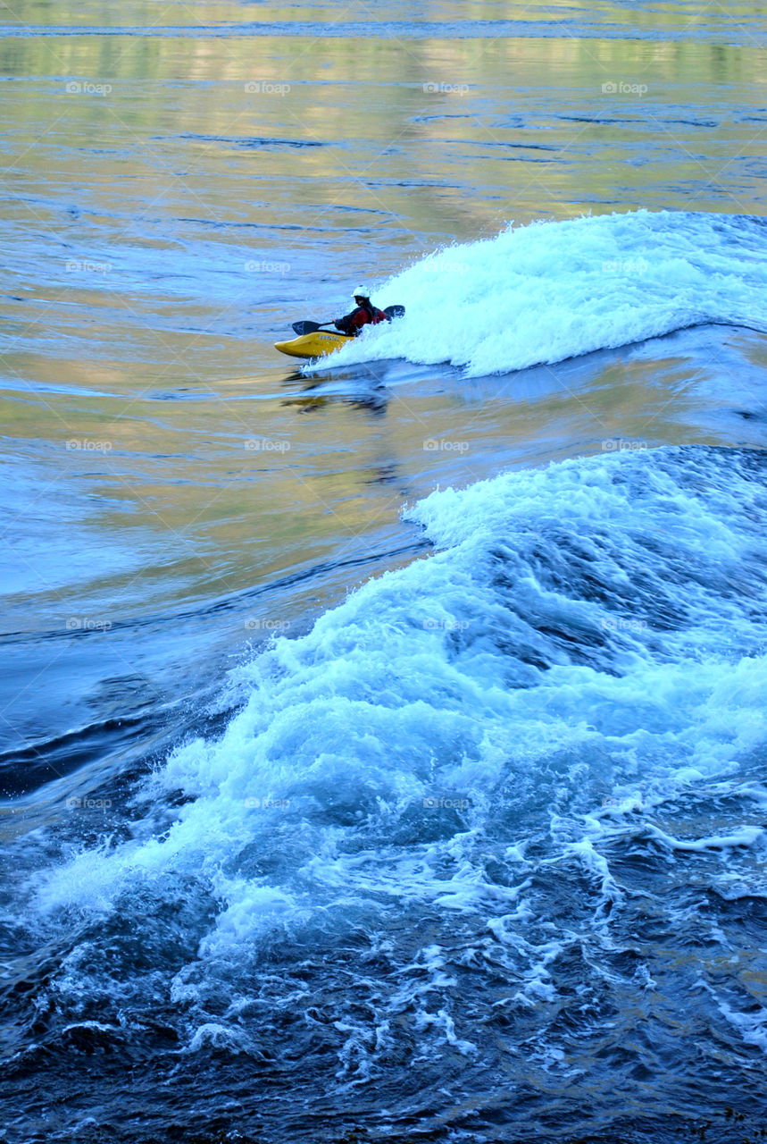 Man Rides the Rapids in a Kayak