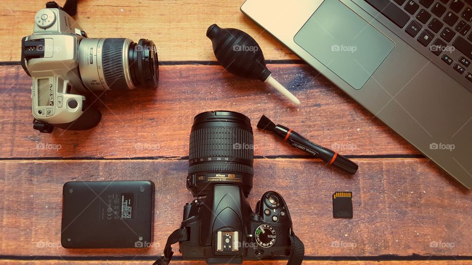 My photography equipment on a wooden desk