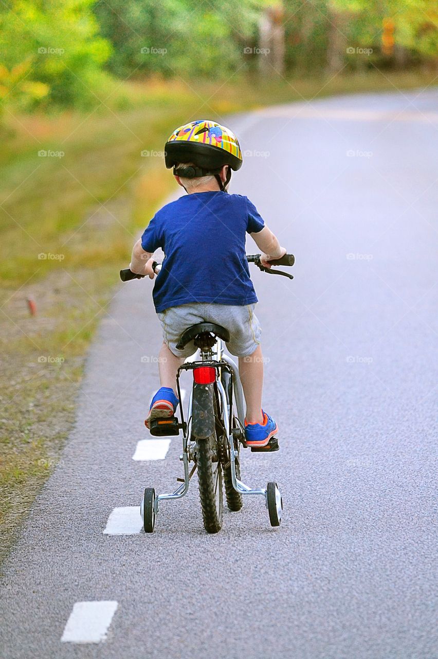 Learning to bicycle. Little boy on his bicycle