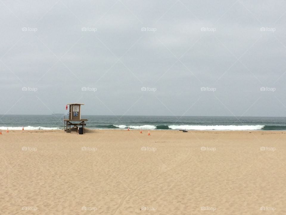 Distant view of lifeguard cabin on beach