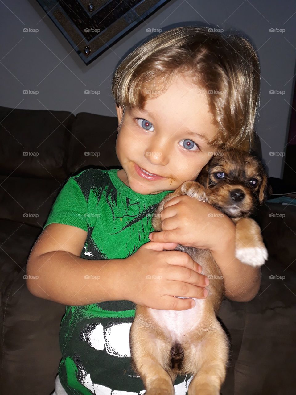 child holding the puppy