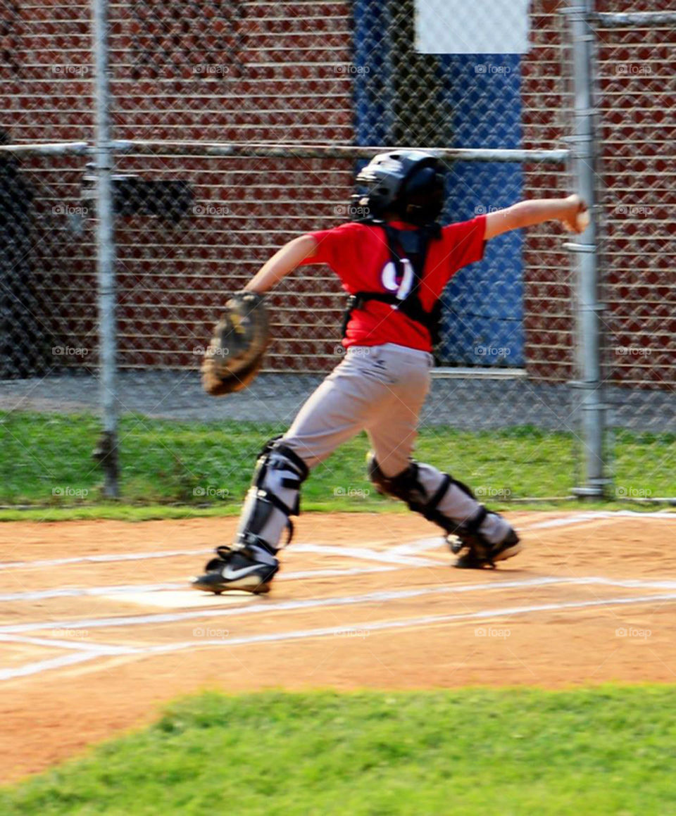 Catcher. Little league catcher in action