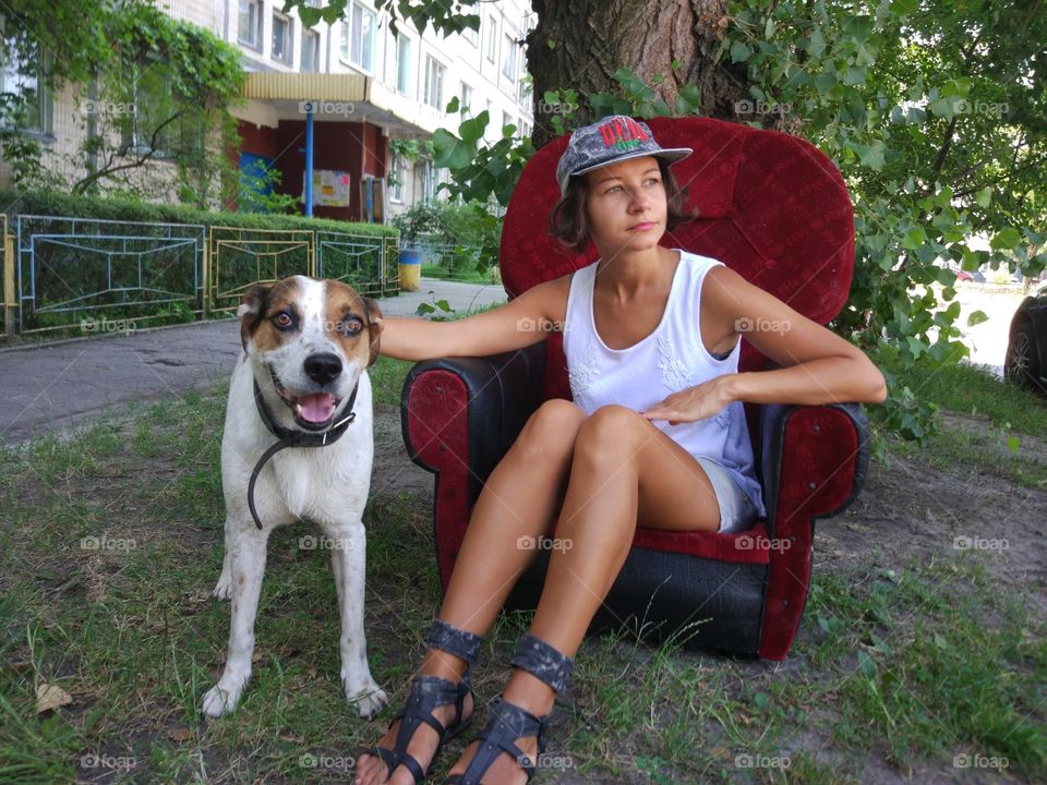 Brunette with funny smiling dog