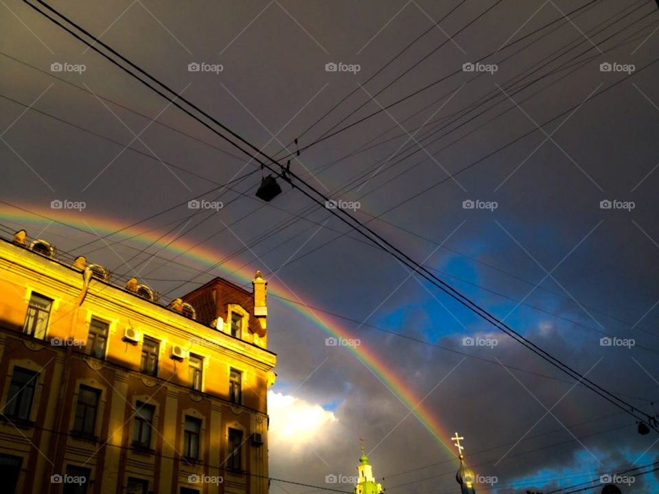 city town clouds sky rainbow view