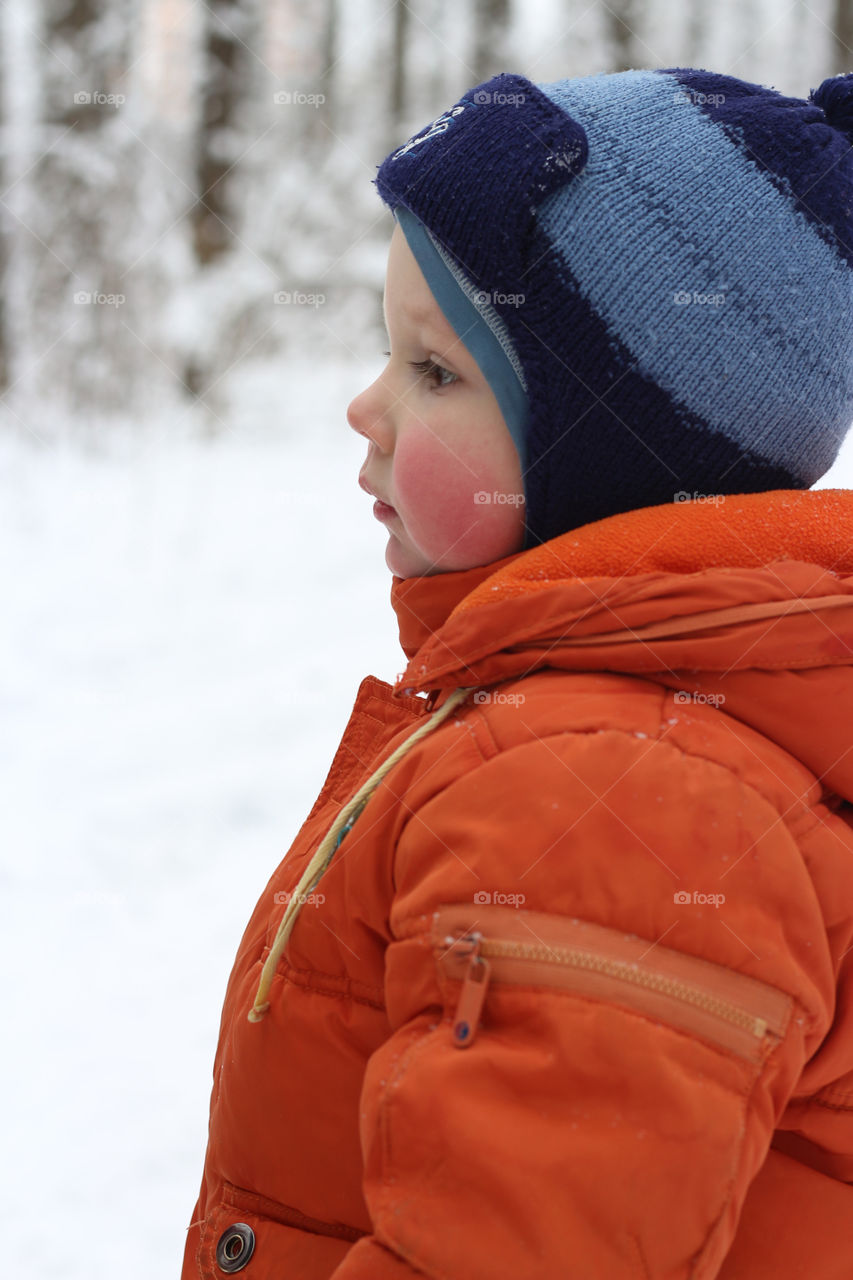 boy walking in winter