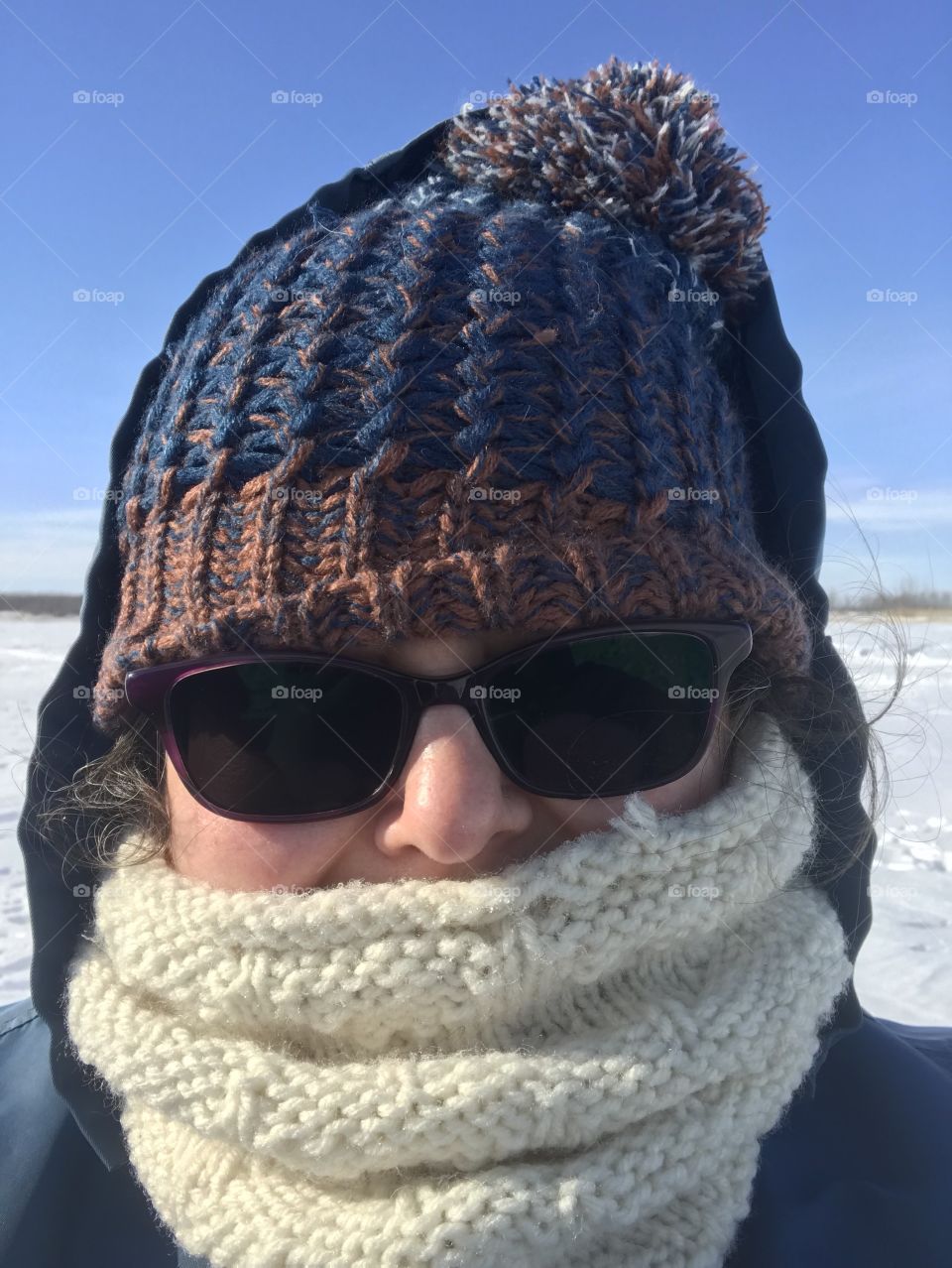 Woman in toque outside in winter. 
