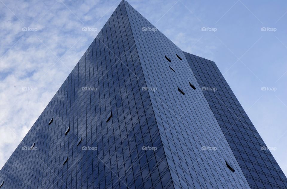 A single skyscraper ascends into the skies above Fort lee, New Jersey near the George Washington bridge.