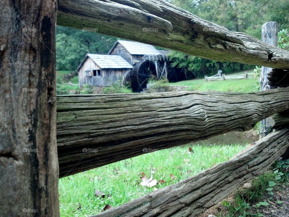 Old mill behind the fence