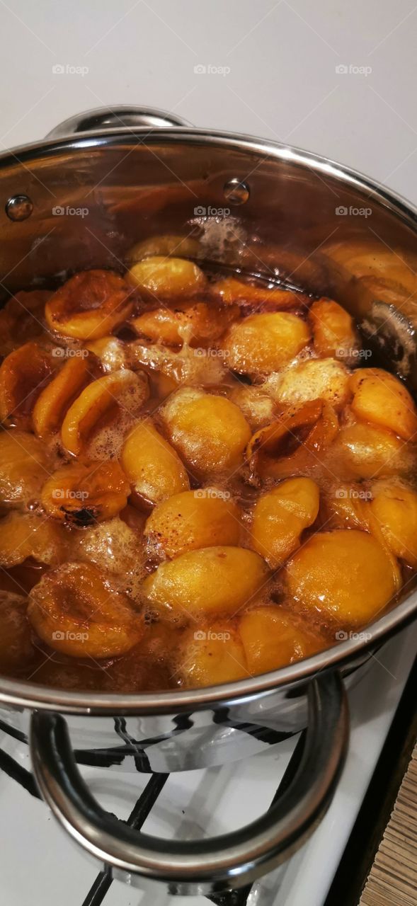 Sweet home indoor food yummy served table day part yellow form circle ellipce tasty apricot jam