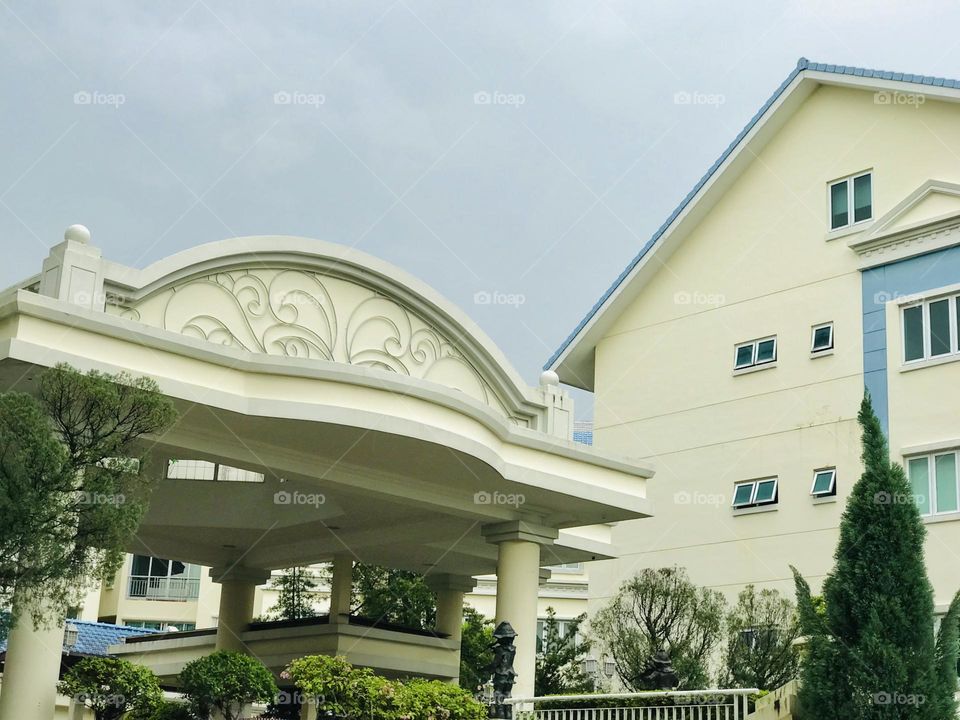 A condominium entrance with beautiful arches 