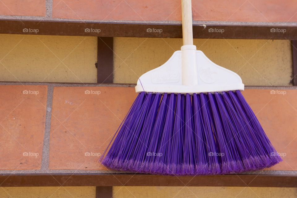 Spring Cleaning broom against wall