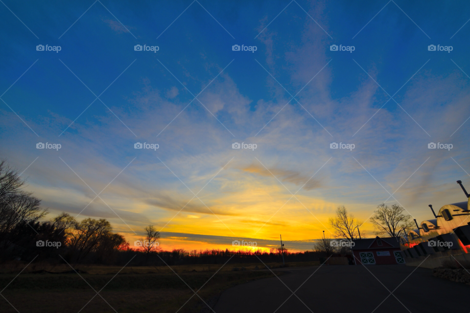 sunset orange clouds trees by delvec