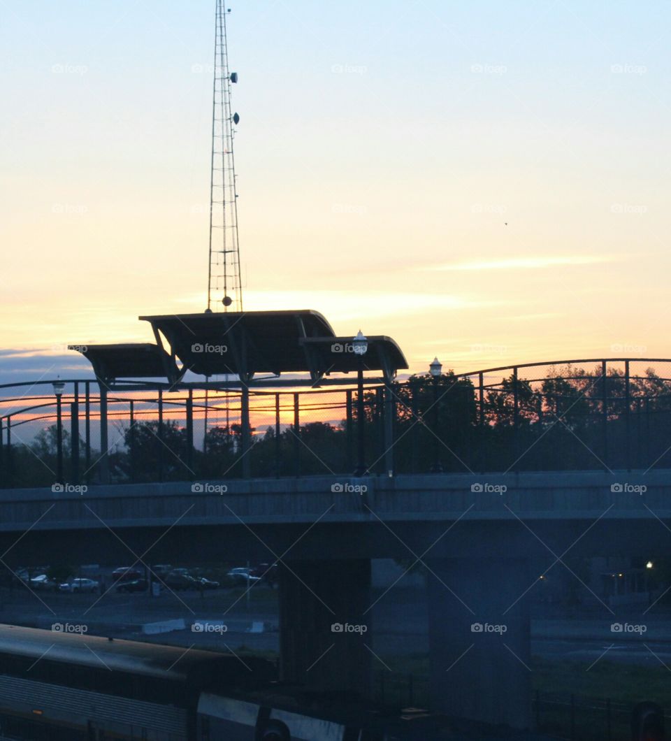 a early morning sunrise as the sun reflects it's rays across the clouds in the sky in downtown Sacramento