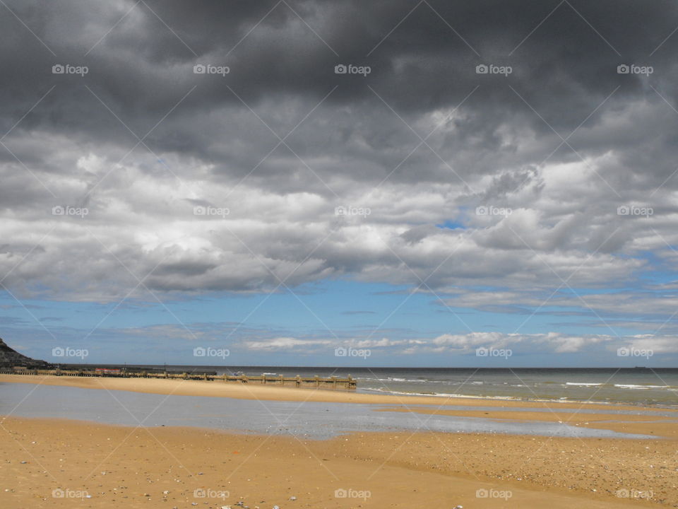 Beach and dark  clouds