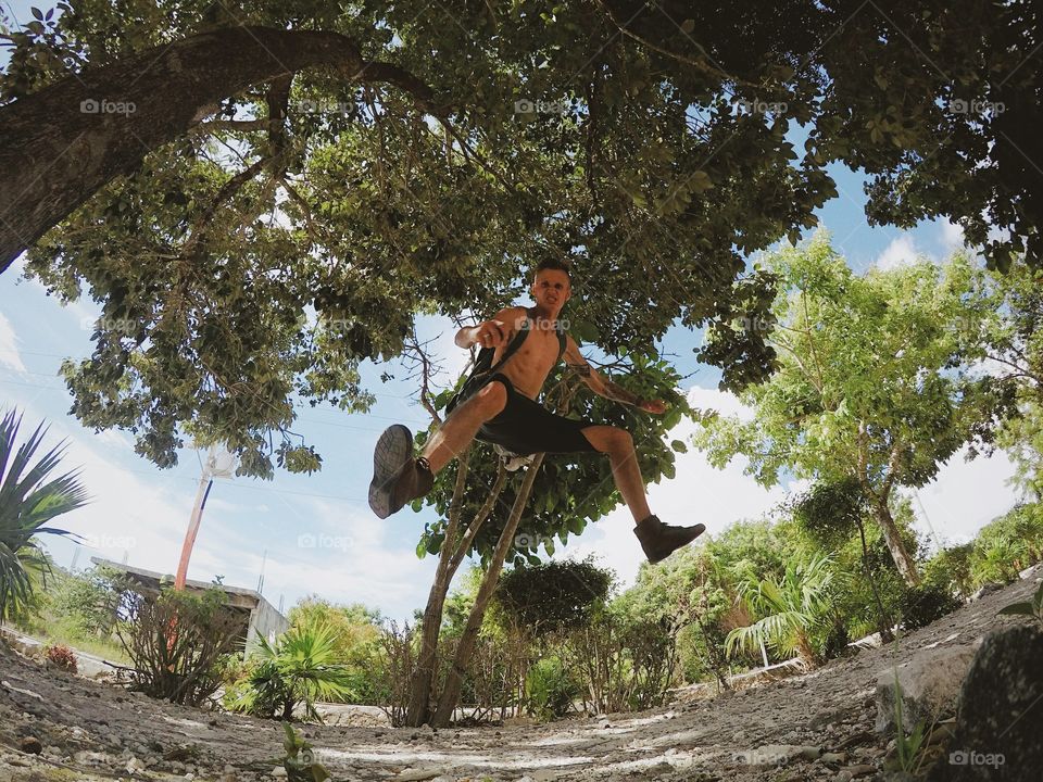 Young man jumping in mid-air