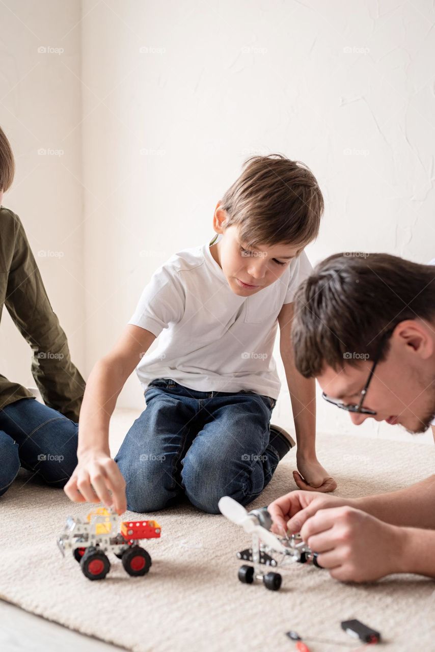 father playing games with sons