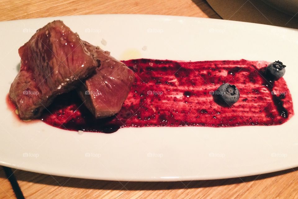 Deer steak with blueberries
