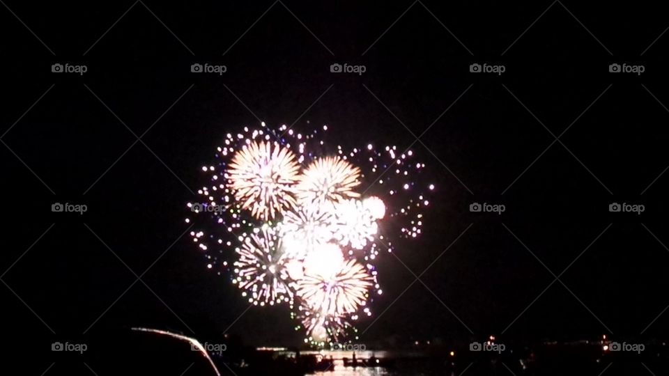 fireworks above boaters