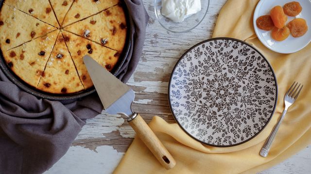 cottage cheese pie with dried apricots and yellow cloth