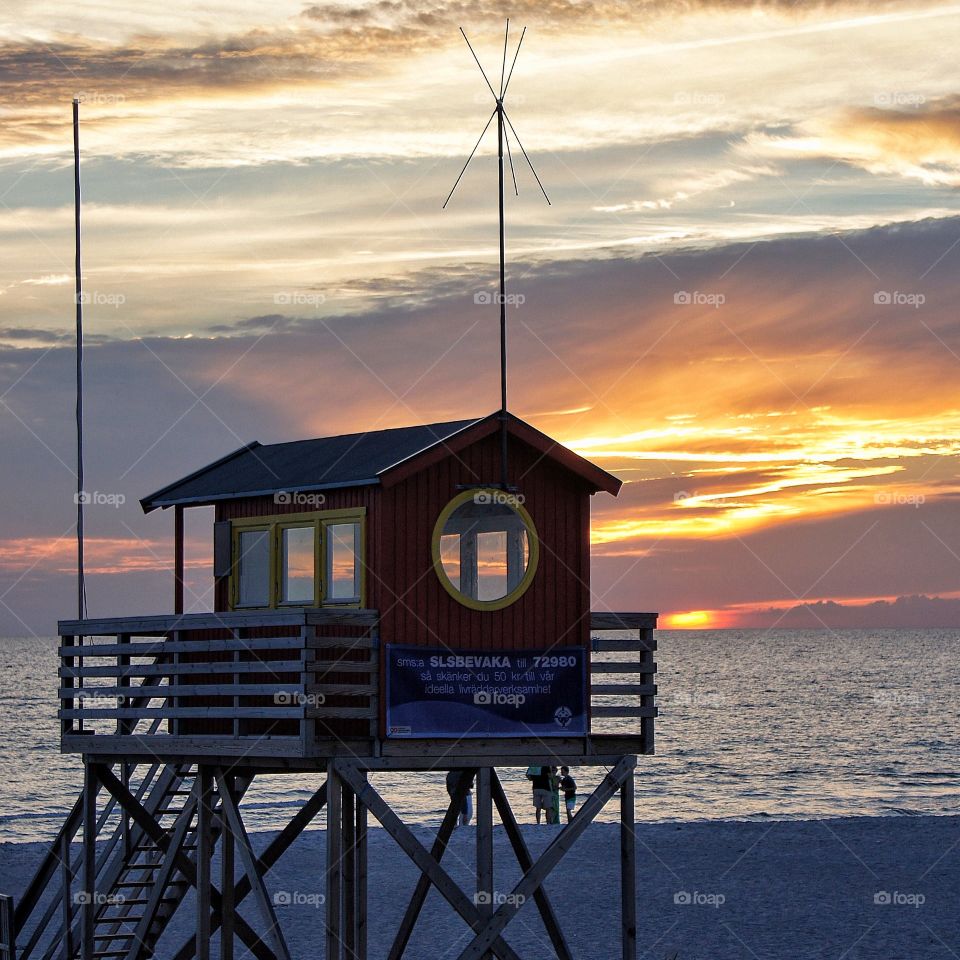 Lifeguard tower in sunset 