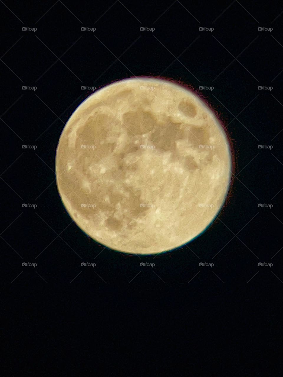 The Hunter’s moon before the partial eclipse Saturday.