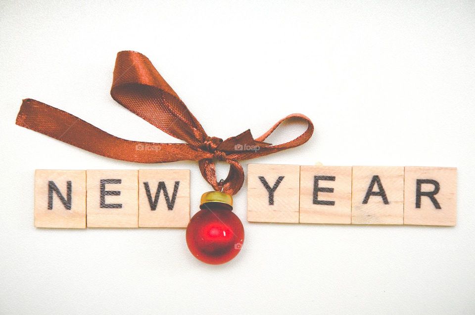 The inscription new year on wooden cubes. Christmas decorations. New year celebrations. Christmas flat lay. Background 