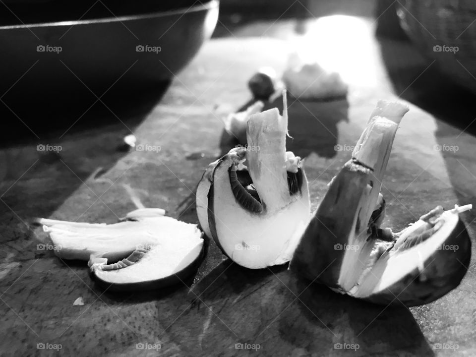 B&W. Opportunity for photos is everywhere! The golden setting sun coming in my kitchen windows produces beautiful highlights and shadows making this simple sliced mushroom a work of art!